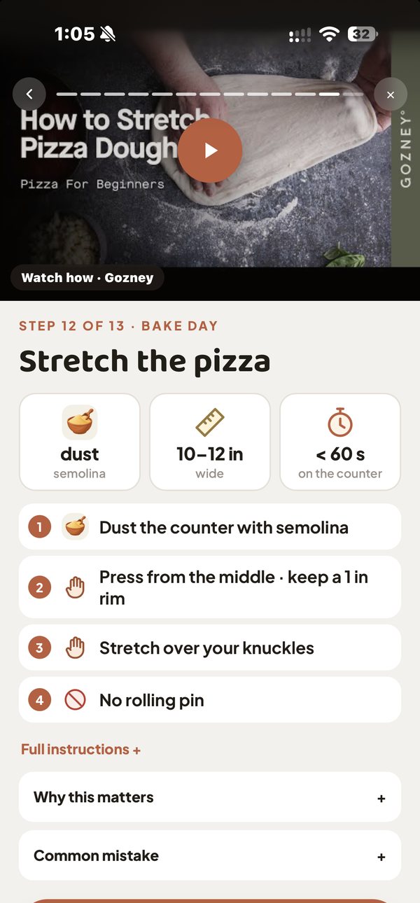 Pizzora cook mode, step 12 of 13, Stretch the pizza: a How to Stretch Pizza Dough video, dust with semolina, 10 to 12 inches wide, press from the middle keeping a 1 inch rim, stretch over your knuckles, no rolling pin